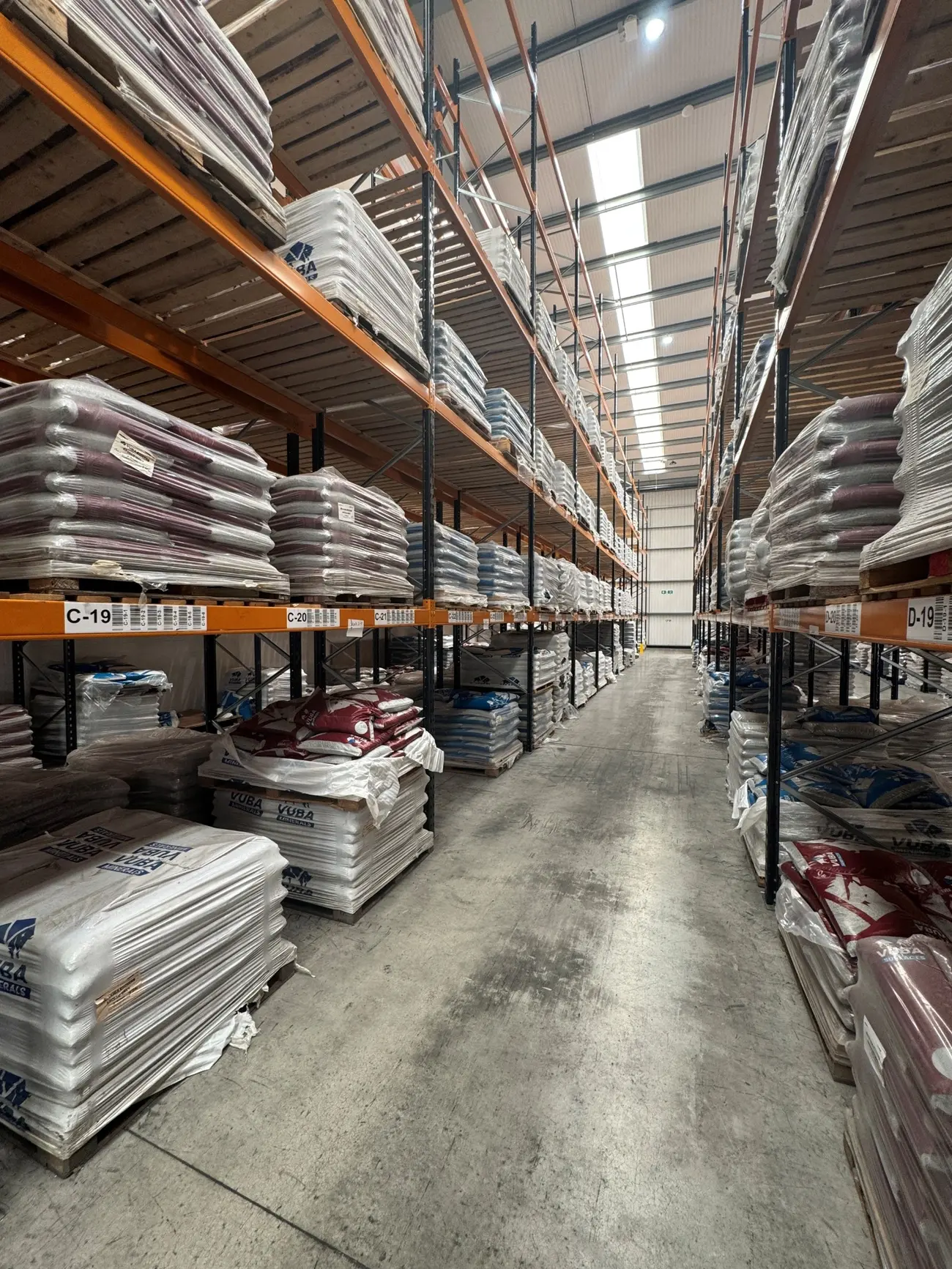 Pallets of Vuba surfacing materials stocked in the Vuba Essex warehouse